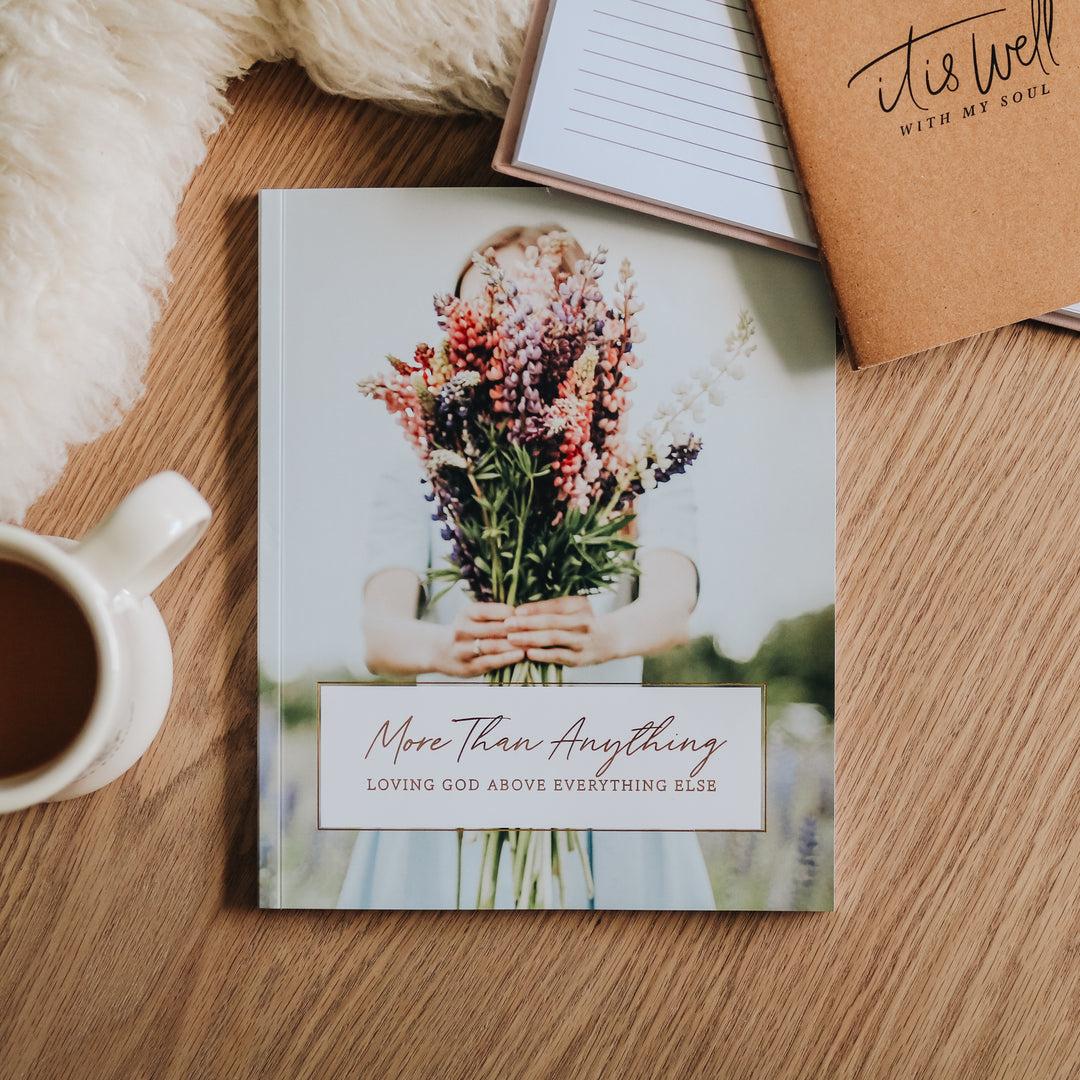 More Than Anything: Loving God Above Everything Else is sitting next to a Daily Grace mug and notepads