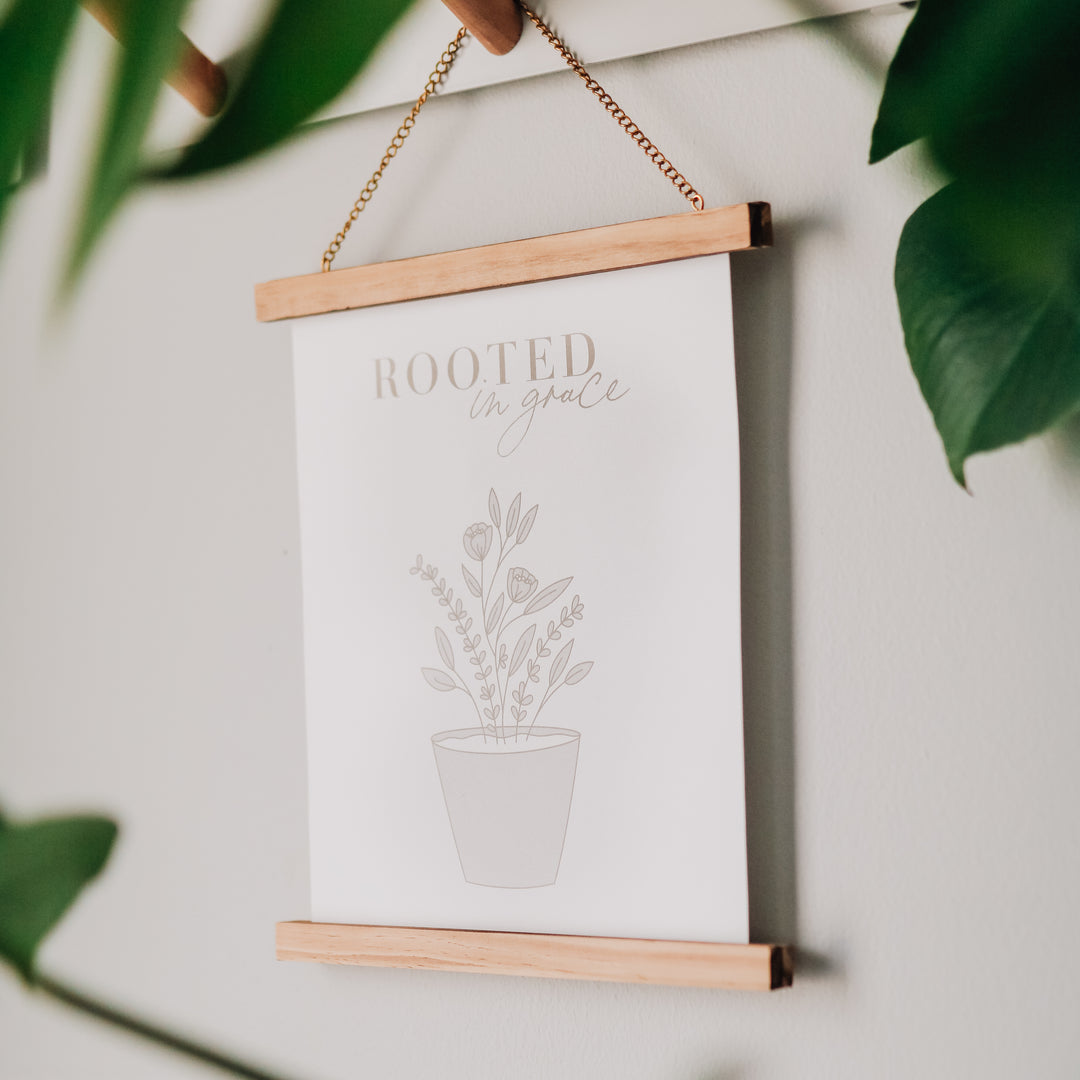 Rooted in grace printout hanging on the wall. 