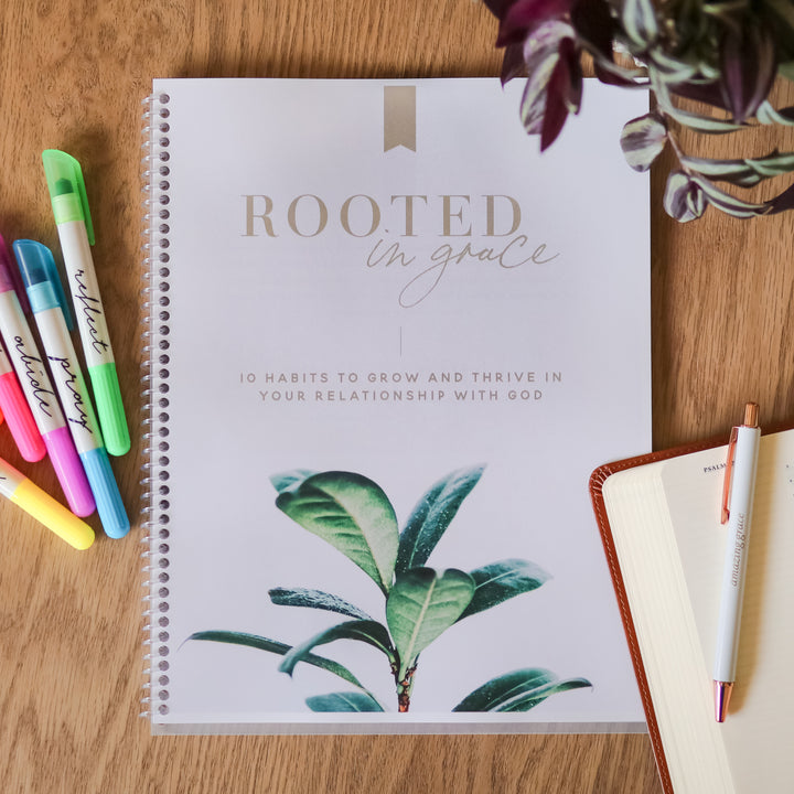 Rooted in Grace workbook with highlighters.