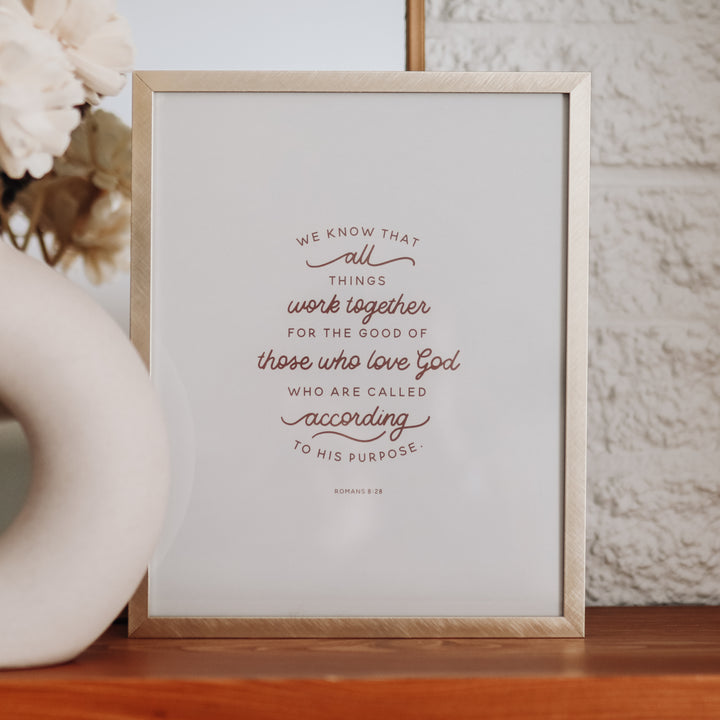 Print of Romans 8:28 on white backing