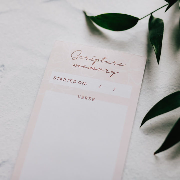 PInk notepad on a white background for Scripture Memory