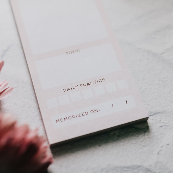 Close up of a Pink Notepad on a white background