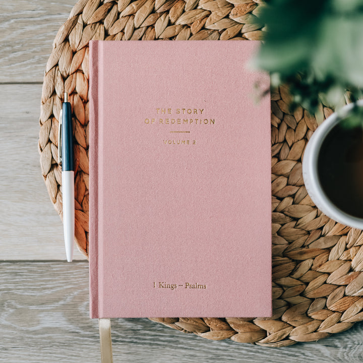 journal cover shown sitting on table next to pen