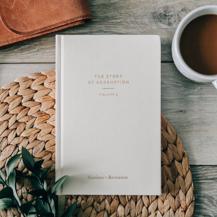 journal on table next to coffee mug