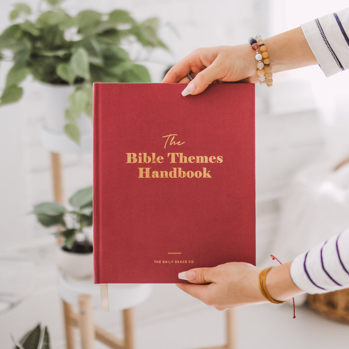 Woman holding handbook