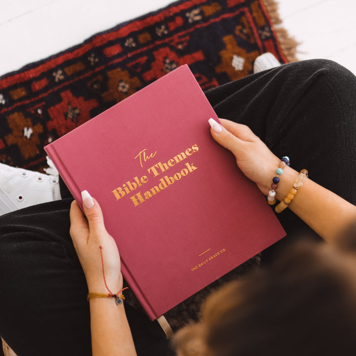 Woman holding handbook