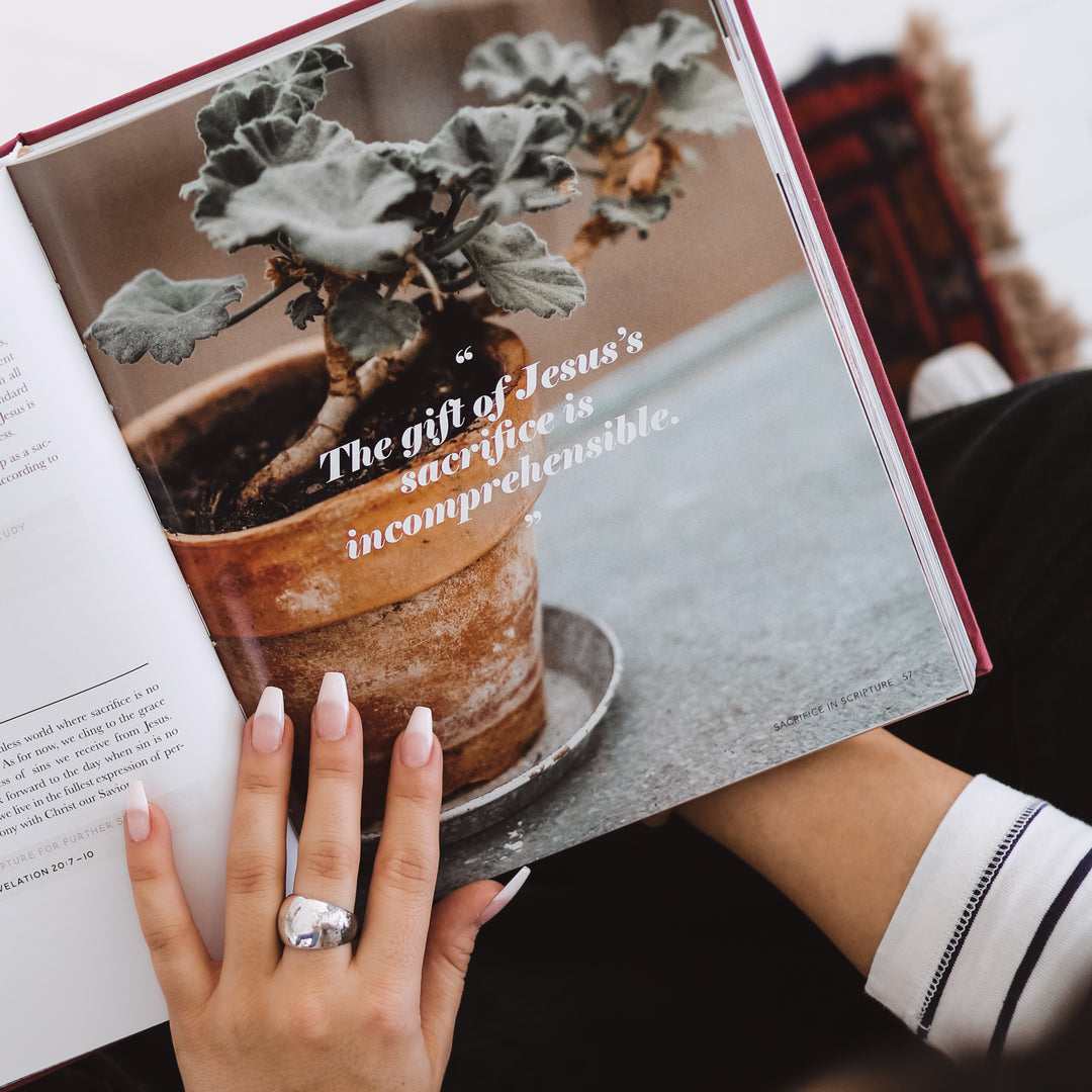 Woman holding handbook on page with a quote