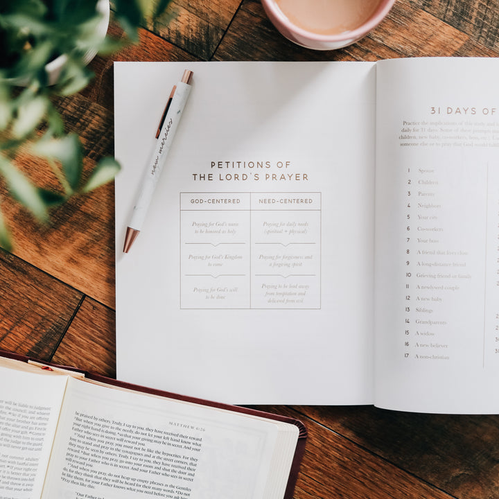 Bible Study open to page around Lord's Prayer with pen on top of page