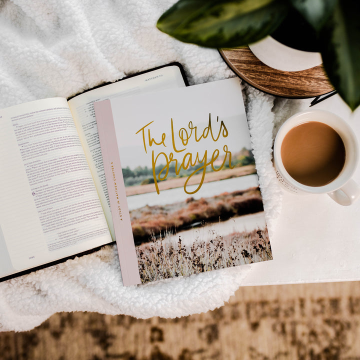 Bible Study on top of Bible with coffee mug