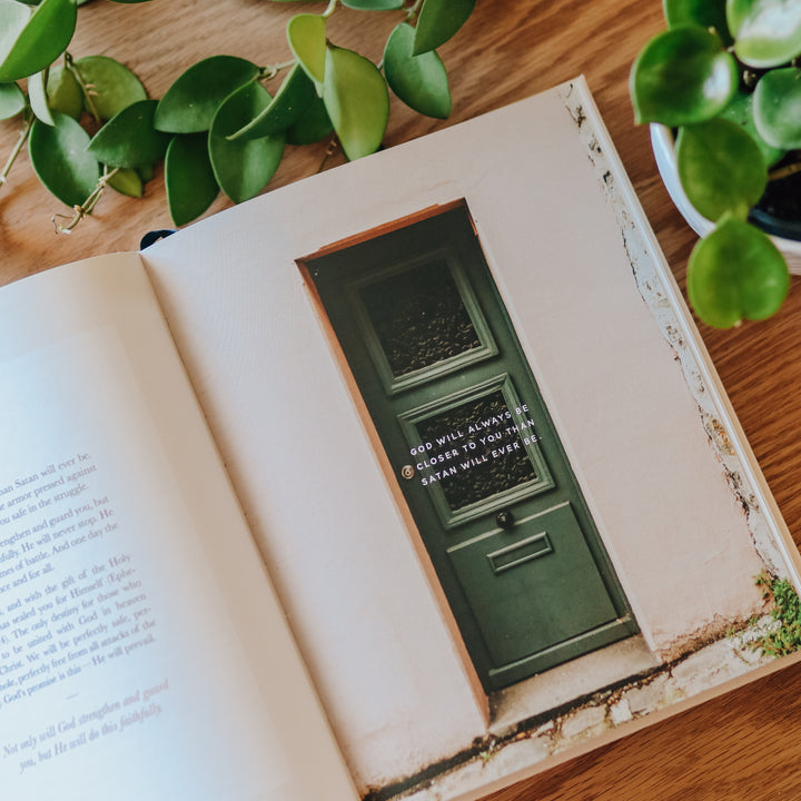 Coffee table book opened to page with photo and quote