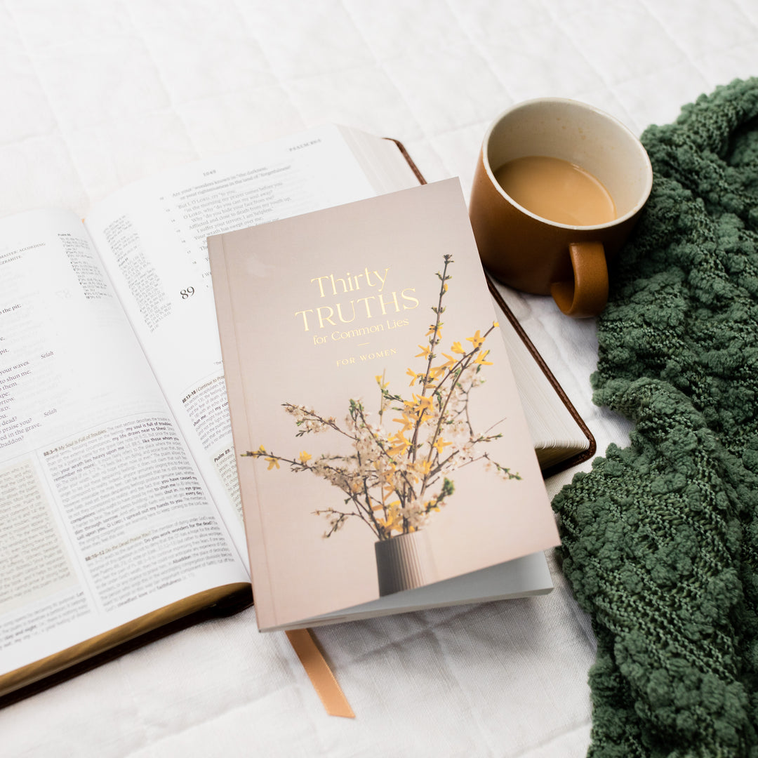 booklet cover shown on top of Bible next to coffee mug