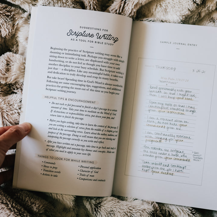 Scripture writing journal open to a journal entry page