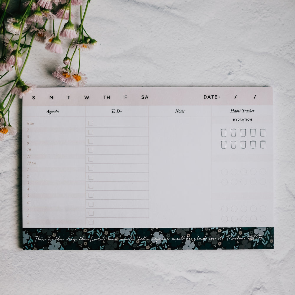 Notepad for women to put their weekly agenda sitting on table