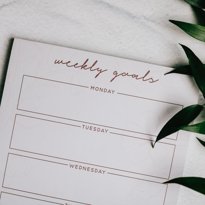 zoomed in photo of notepad for writing weekly goals