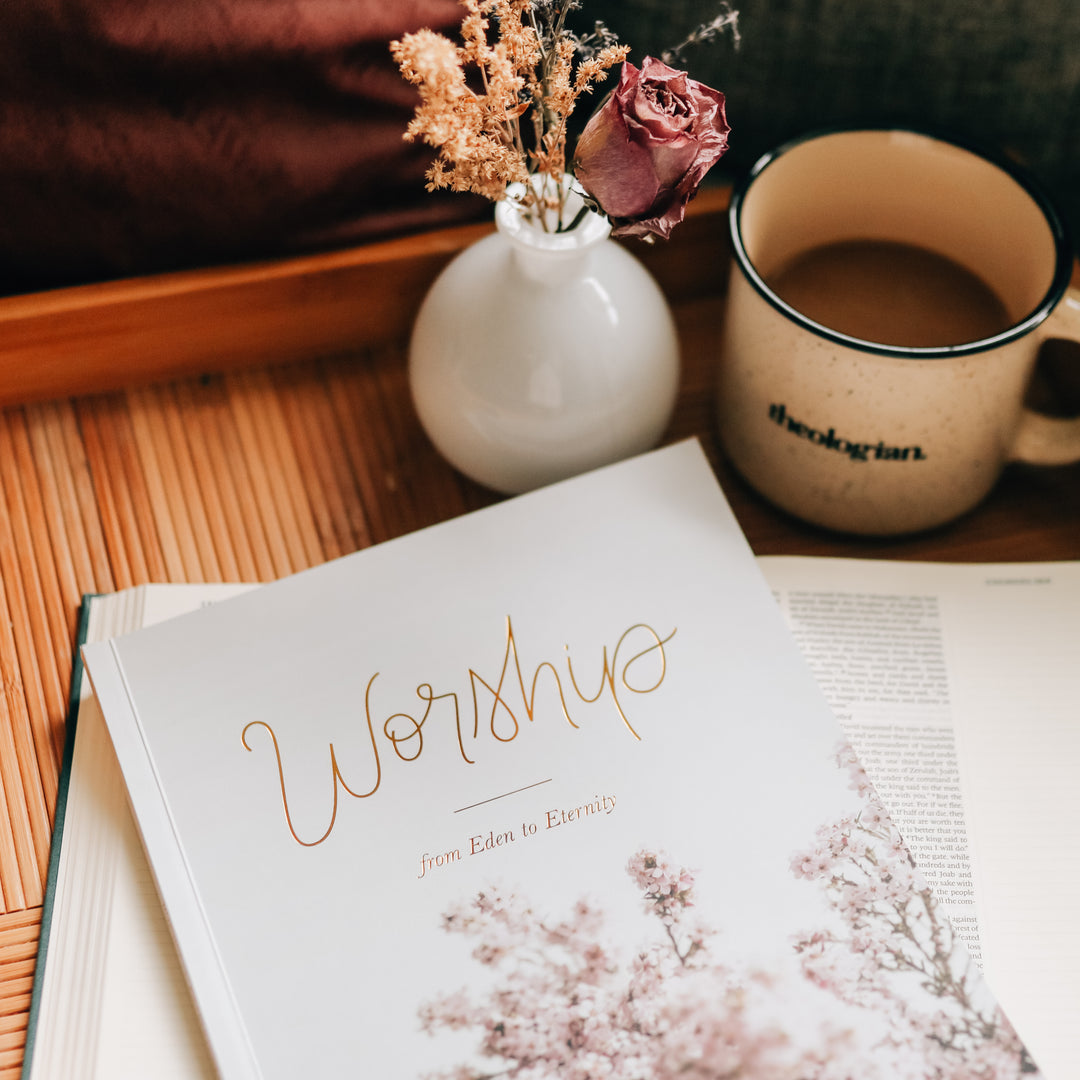 women's Bible Study on worship sitting on next to flowers